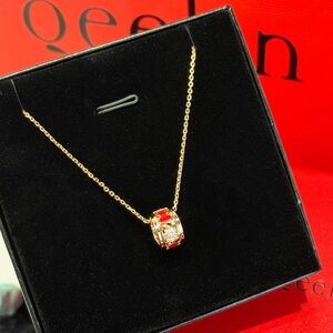 Elegant Gold Necklace with Red Accents